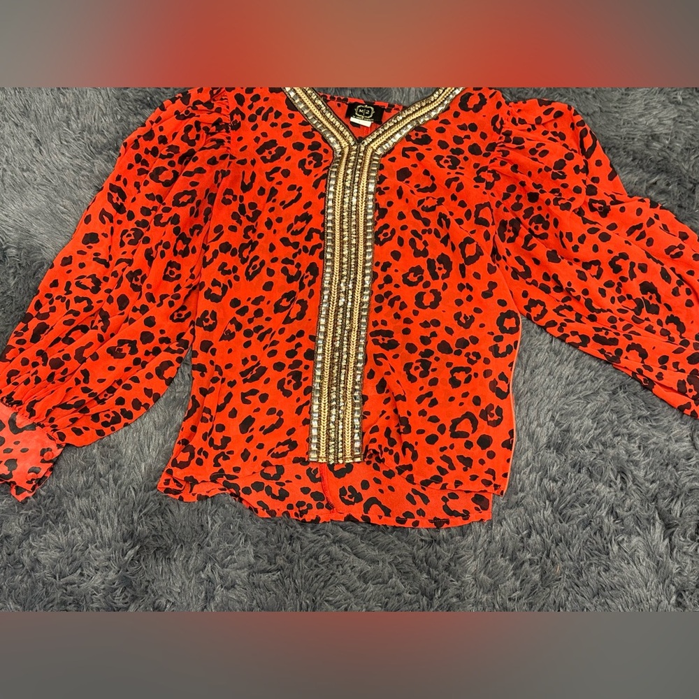 Chic Red Animal Print Blouse with Gold Detailing